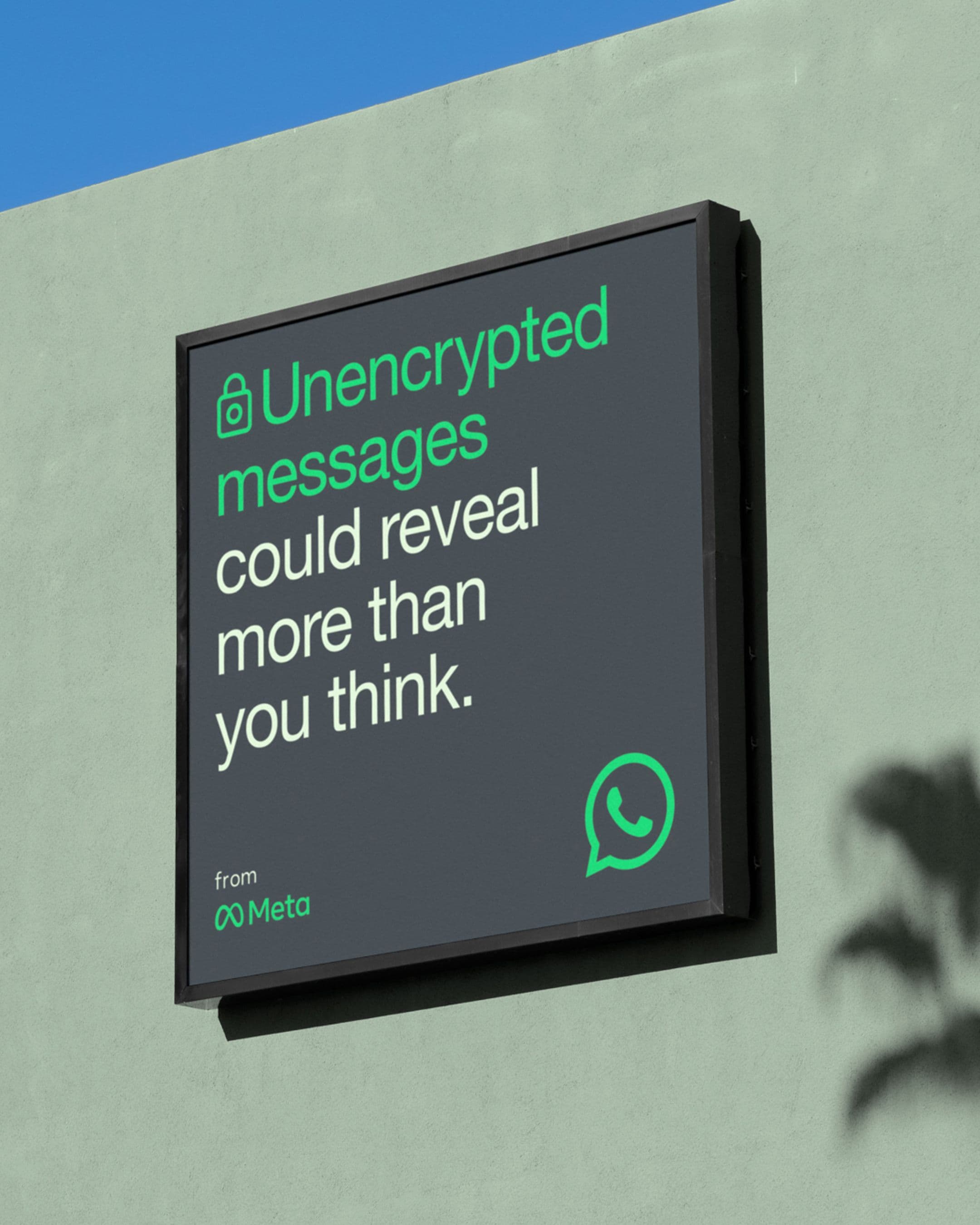 WhatsApp billboard on green wall warning: 'Unencrypted messages could reveal more than you think.