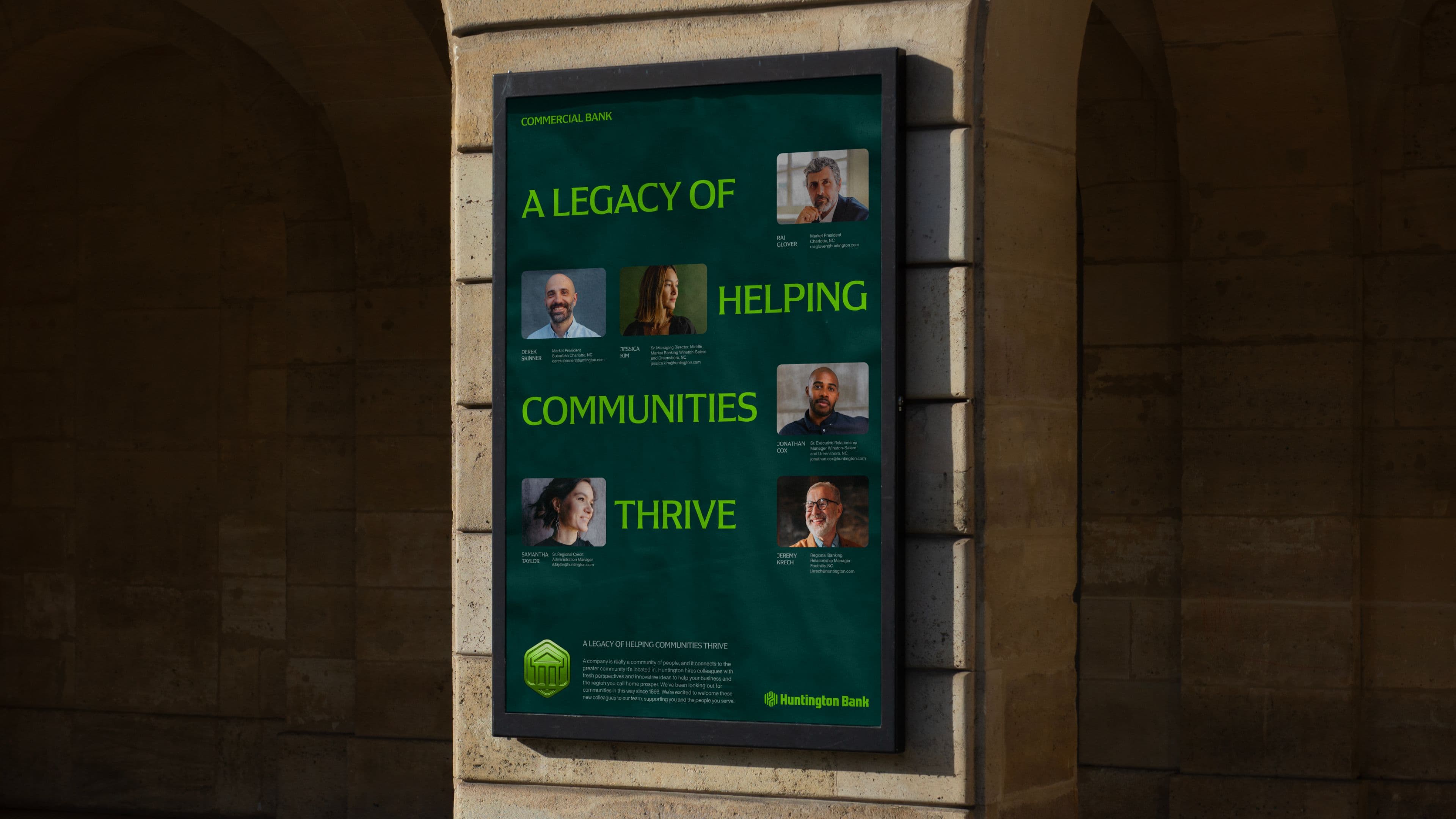 A wall-mounted poster reads A Legacy of Helping Communities Thrive with photos of their customers and a brief description of their background.