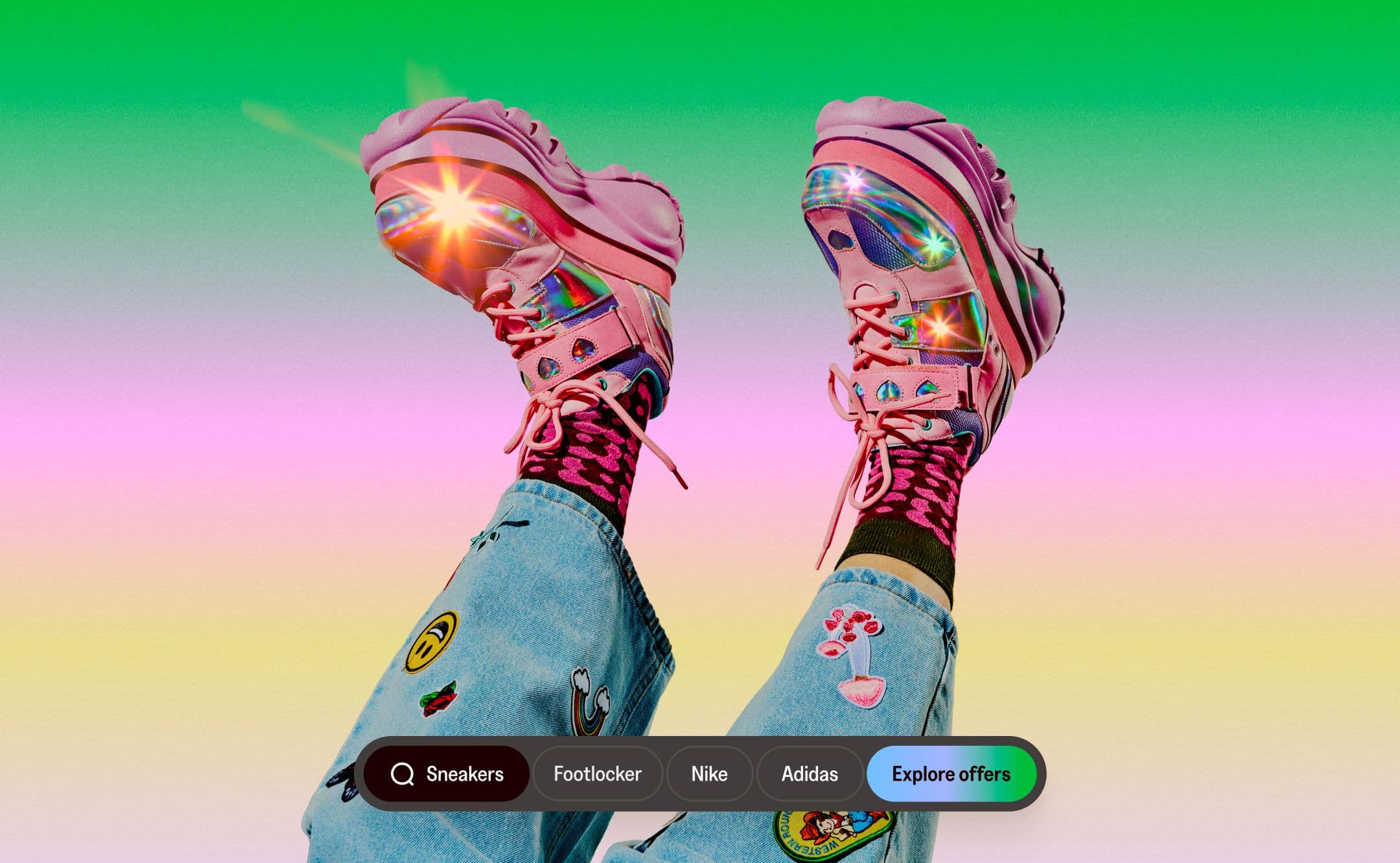 Person wearing bright pink sneakers and colorful socks with jeans decorated by patches, with legs playfully raised. A search bar for sneakers appears at the bottom.