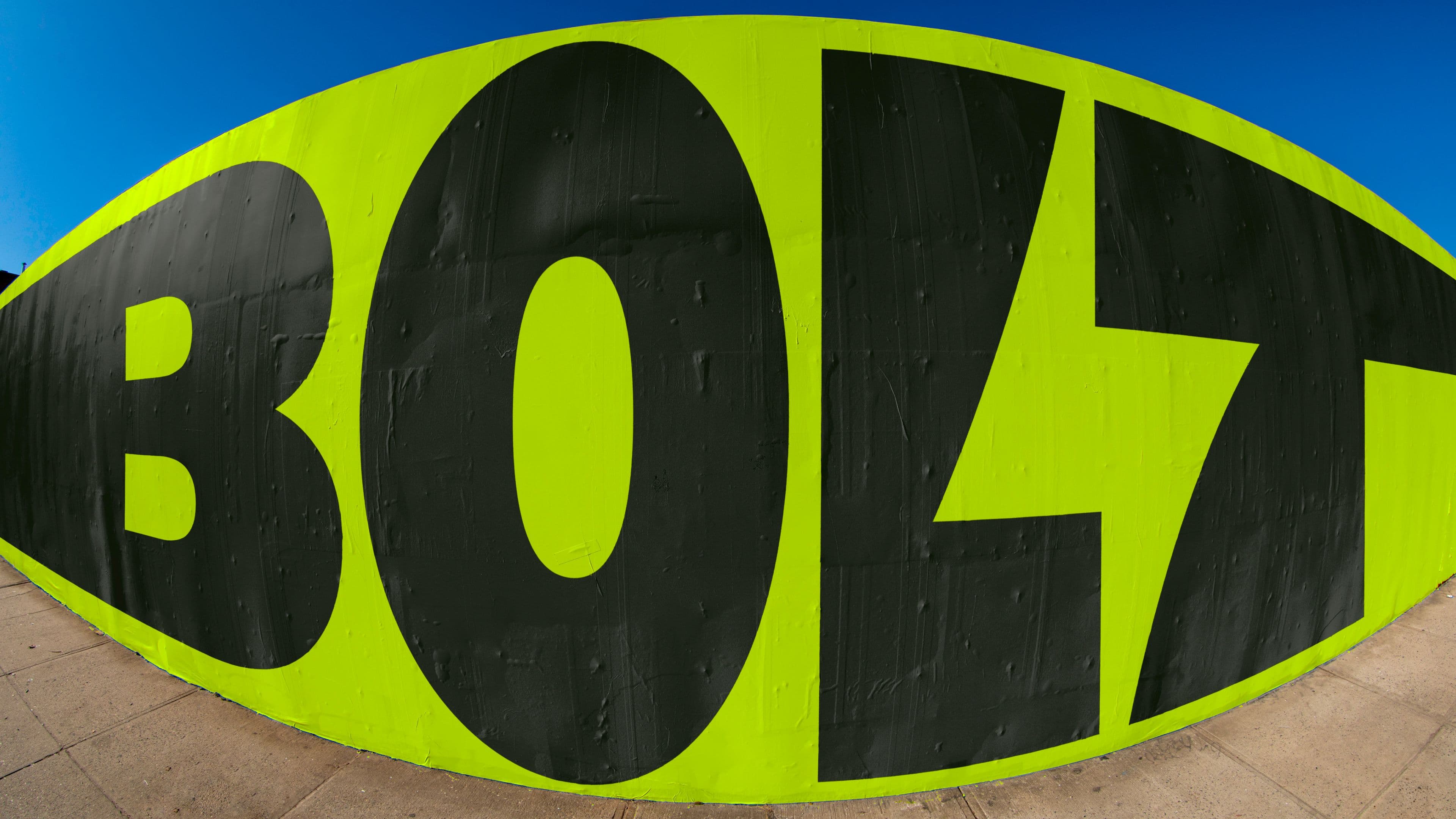 Bolt logo displayed on a wall poster, photographed with a fisheye lens.