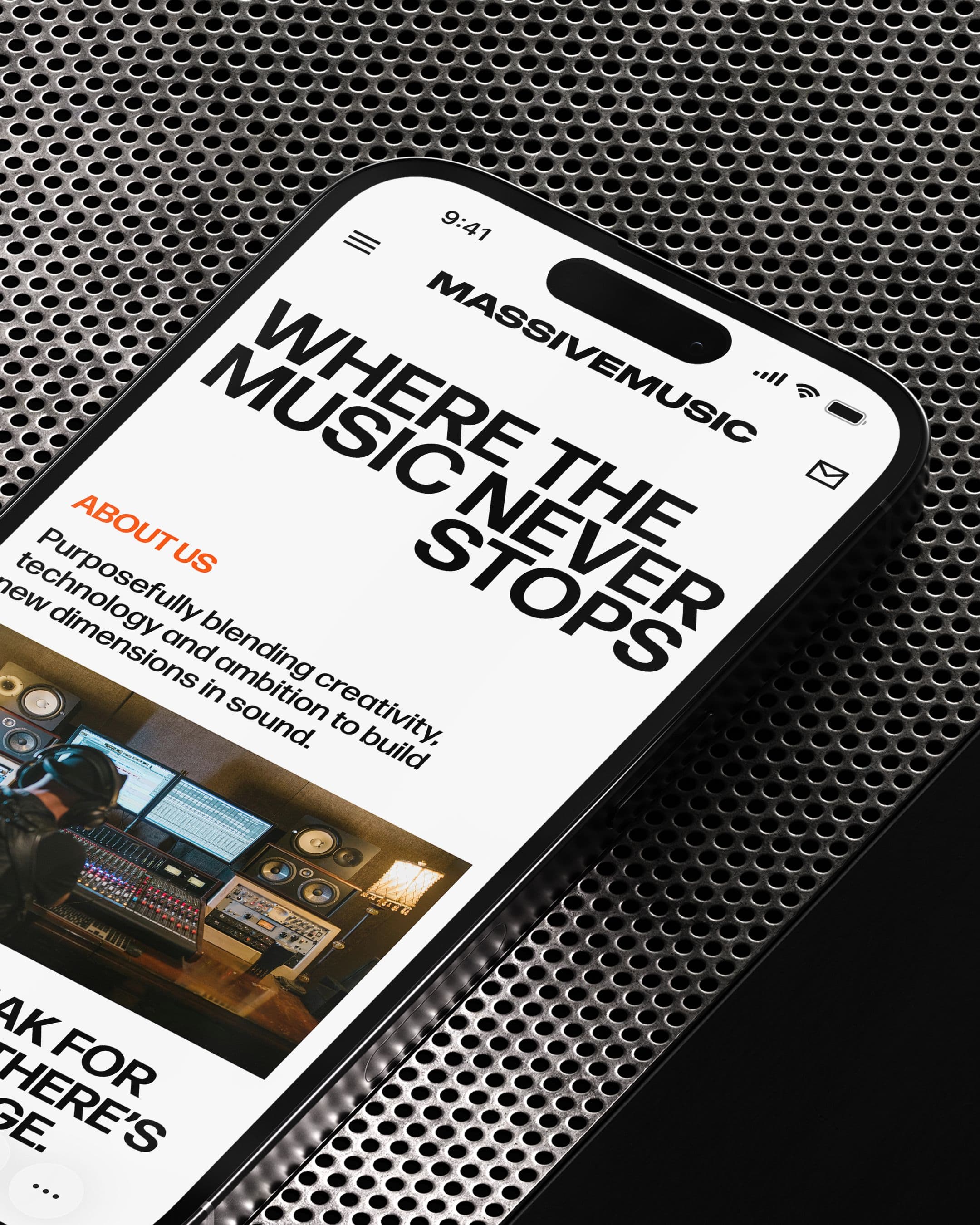 A smartphone displaying the MASSIVEMUSIC website with the headline “WHERE THE MUSIC NEVER STOPS” in bold black text.