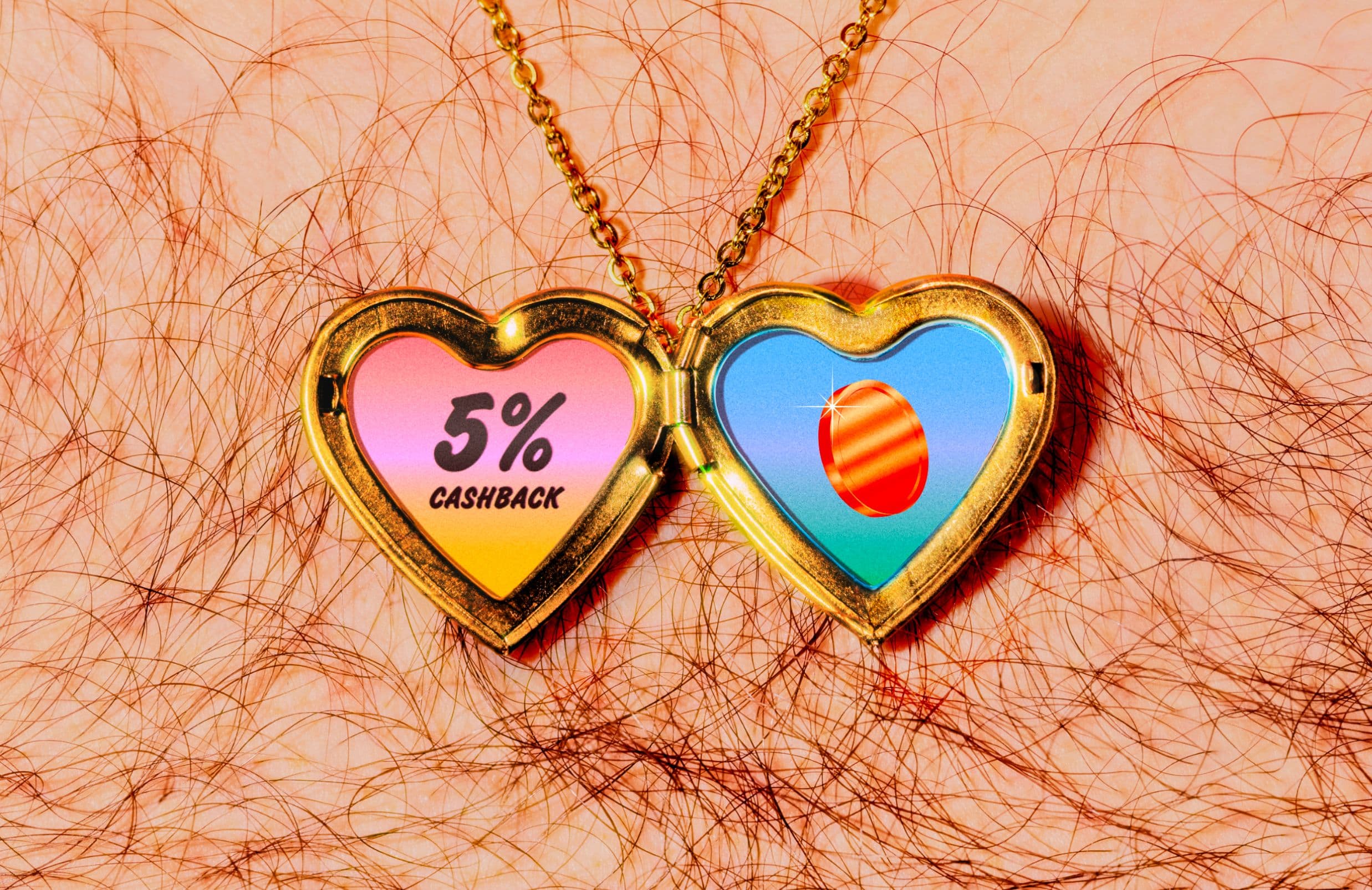 A gold heart-shaped locket on a hairy chest, opened to show one side with “5% CASHBACK” text on a pink and yellow background, and the other side with a coin illustration on a blue background.